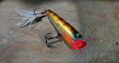 Artificial fishing lure that is used on the surface for largemouth bass.