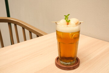 Lychee iced tea with mint leaves
