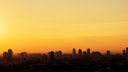 Obraz premium building city shadow sunset office building background business city with sunset urban in the shadow land