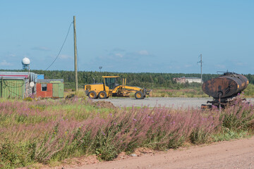 grader Heavy equipment at worksite, Grader Loader in action on highway, Construction Machinery on a...
