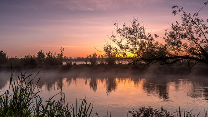 Sunrise over the Suprasl River at the boulevard in Suprasl.