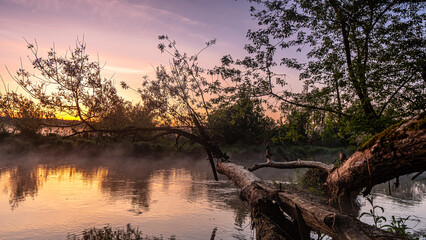 Sunrise over the Suprasl River at the boulevard in Suprasl.