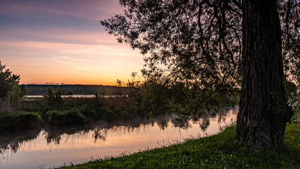 Sunrise over the Suprasl River at the boulevard in Suprasl.