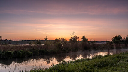 Sunrise over the Suprasl River at the boulevard in Suprasl.