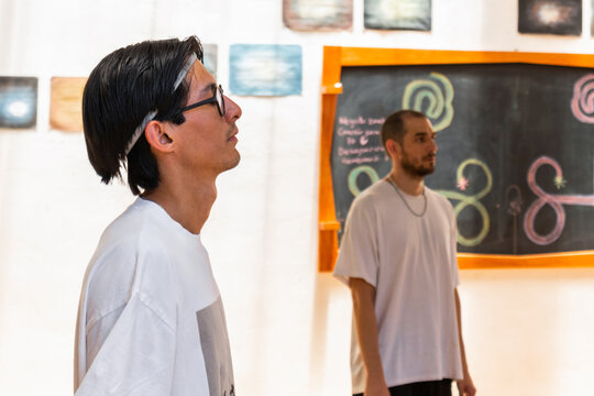 Participants Engaged in a Holistic Dance Workshop