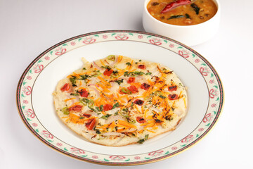 Uthappam or uttapam is a type of dosa from South India which is thicker, with tomato, onion and chilli toppings