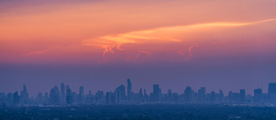 Sunrise over modern office buildings in district center of Bangkok. Panoramic skyline view of...