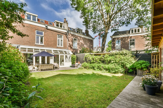 Tranquil Backyard of a Suburban Brick House