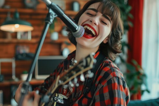 A woman singing into a microphone while holding a guitar. Suitable for music and performance concepts
