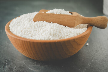 White Sago Pearls in Wooden Bowl Also Know as Sabudana, Tapioca Pearl or Sago Seeds isolated on Gray Background
