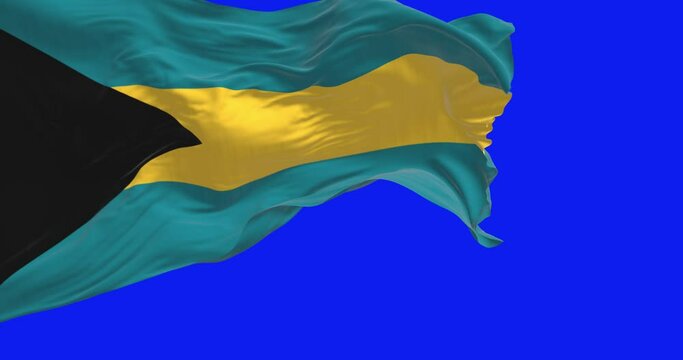 Close-up view of the Bahamas national flag waving isolated on blue background