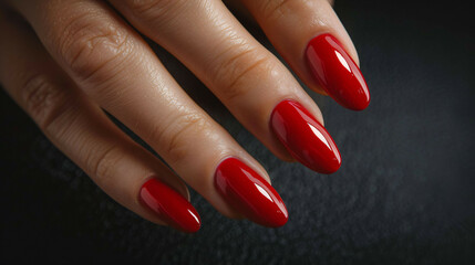 Elegant woman's hand with red manicure, luxury beauty concept