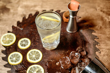 Refreshing Glass of Water With Sliced Lemons on a Tray