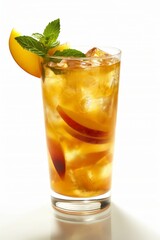 A tall glass of peach juice with a slice of peach on top