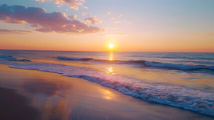 Fototapeta premium The ocean is calm and the sun is setting, creating a beautiful