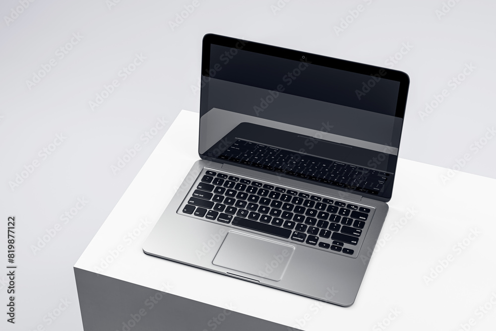 Aufkleber sophisticated laptop on a white podium with a dark screen, set in a minimalist environment, ideal fo