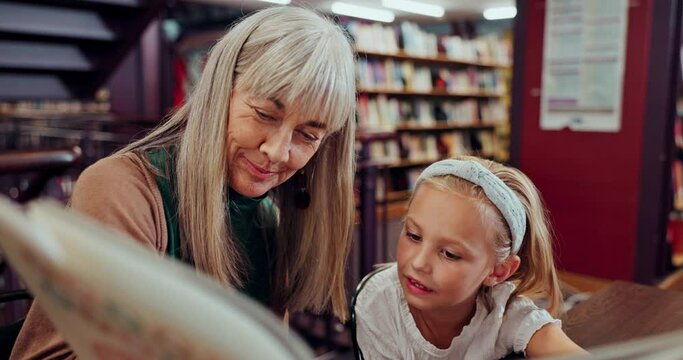 Girl, child and book with grandmother in library for education, growth and development with literature. Kid, senior woman and reading for learning, language and support with knowledge in bookshop