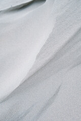 Dune Sand Ripple Closeup Texture in Cold Winter Morning Sunlight with Shallow Depth of Field