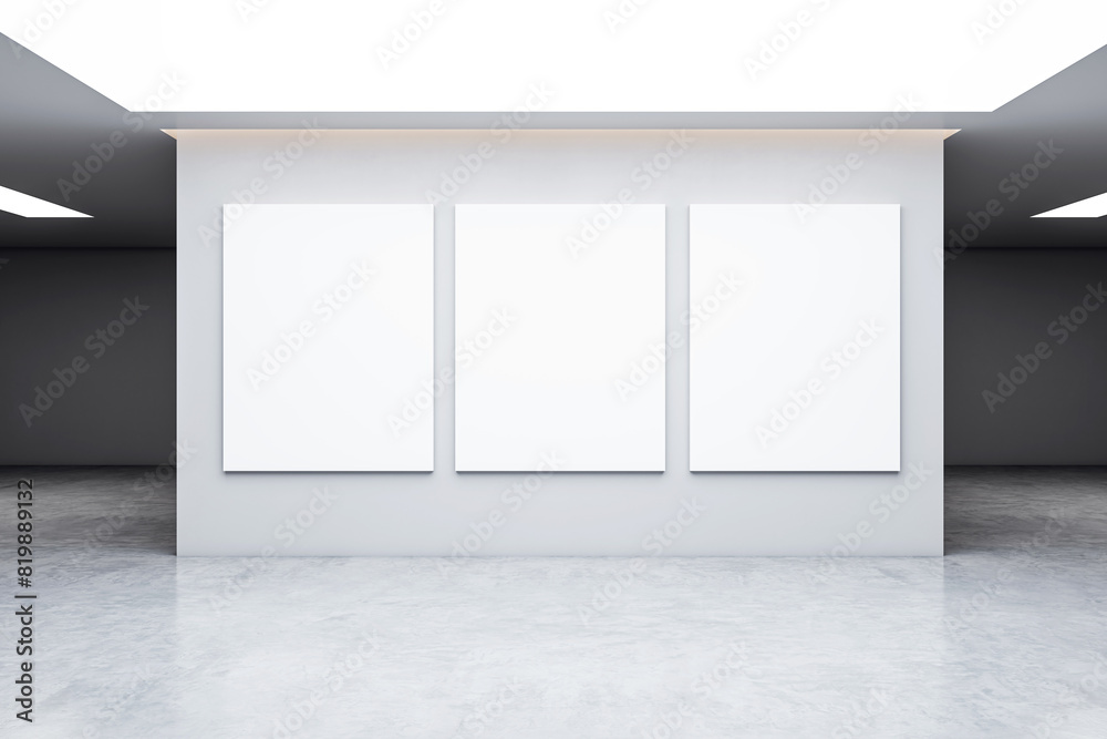 Poster three blank canvases displayed on a gallery wall, with a minimalistic modern design, on a light back
