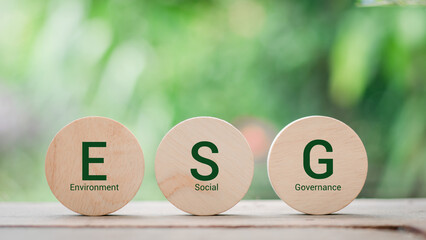wood block with icon ESG, environment social governance investment business concept and sustainable...