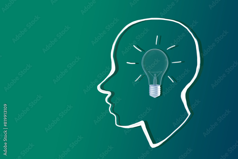 Poster a silhouette of a human head with a light bulb concept inside on a teal background, representing cre