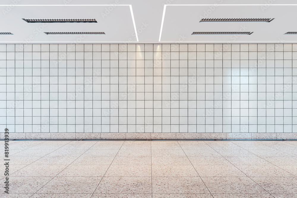 Poster empty subway station with a clean tiled wall and floor, modern ceiling lights, concept of public tra