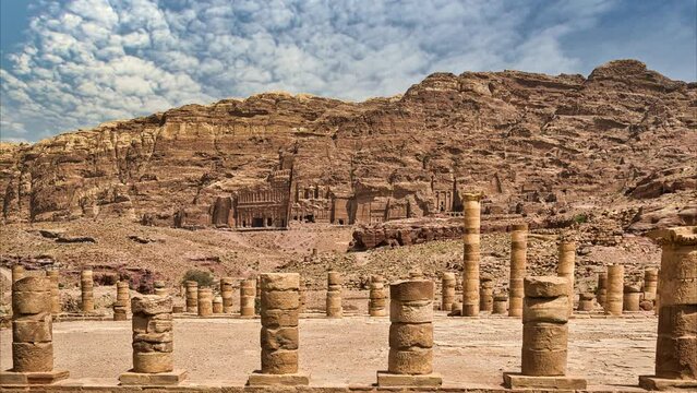 Royal tombs in front of Al Khubtha mountain, columns of the Great Temple of the Nabataean ancient city of Petra, Jordan.