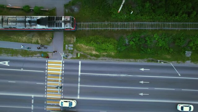 Railroad along the highway and a passing train