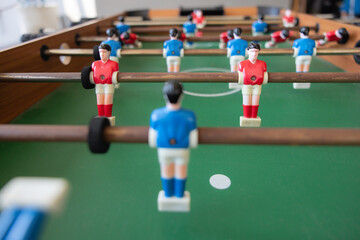 A group of soccer players are playing a game of soccer