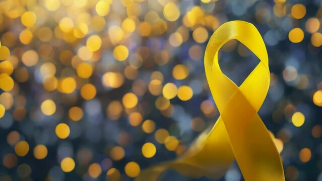 A yellow ribbon with a black background. The ribbon is a symbol of hope and support for those affected by a certain cause