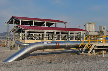 Oil Pipe in an Oil Field with Inscription “Oil”