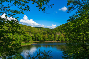 A landscape view of the Allegheny River in Deerfield Township, Pennsylvania, USA on a sunny spring day