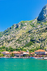 Kotor  Montenegro, May 11, 2024: The Bay of Kotor and boats and the mountainous background. The Adriatic Sea Coast on a sunny, hot, Spring Afternoon.