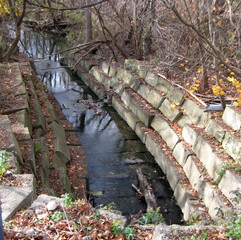 Using erosion control along the banks and bed of a river.