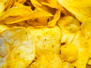 Indulgent Chips Stack. A stack of tempting potato chips with herbs.