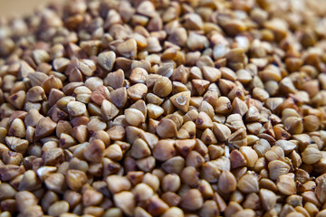 Raw Buckwheat Pile. Buckwheat grains filling the frame, perfect for culinary and health themes.