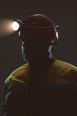 Studio portrait of a young production worker in work uniform. 