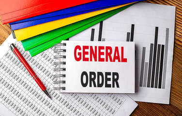 GENERAL ORDER text on notebook with folder on chart