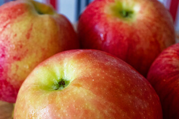 Juicy Apples Display. Several juicy apples, vibrant colors, natural imperfections visible. Uses for Culinary websites, dietary guides.