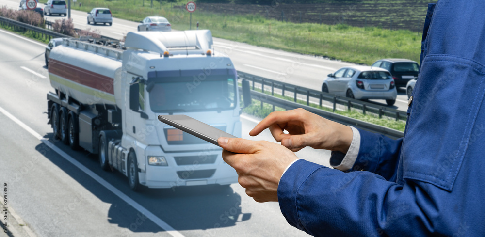 Aufkleber Manager with a digital tablet on the background of truck. Fleet management..