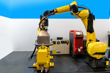 Welding robot arms on a smart factory.