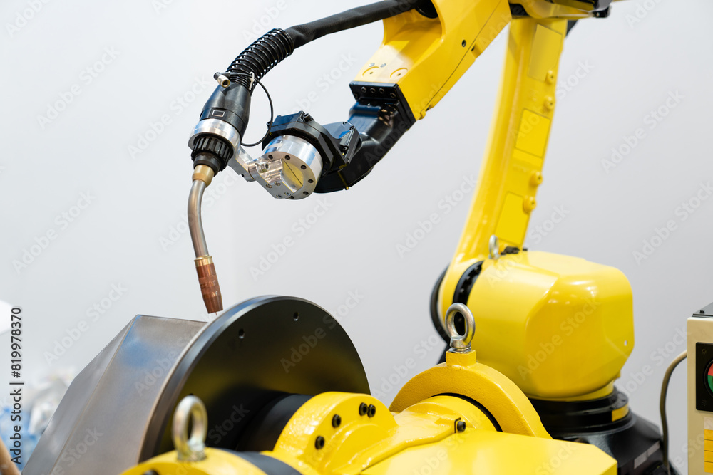 Poster welding robot arms on a smart factory.