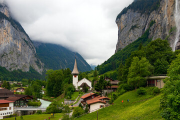 Spectacular view of Lauterbrunnen a Swiss mountain valley in the Alps between gigantic rock faces and mountain peaks with its thundering waterfalls and colourful alpine meadows