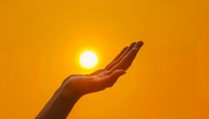 A human hand holding the sun against a solid color backdrop with copy space