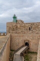 view of the Maniace Castle and lighthouse in Isola di Ortigia in Siracusa
