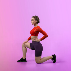 Full body length gaiety shot athletic and sporty young woman in fitness exercise posture on isolated background. Healthy active and body care lifestyle.