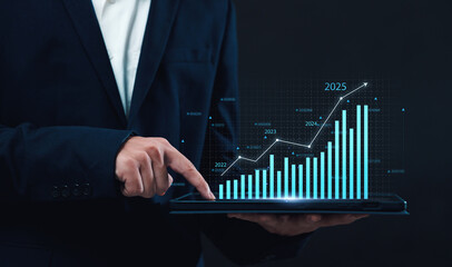 Business 2025 analytics tools charts and graphs with statistics to analyze business potential and forecast future development of companies growth. Businessman using a tablet.