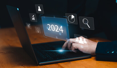 Businessman's Strategic Planning, Creative Thinking, and Target Goals for Year 2024, Achieving Success through Innovative Strategies, Using Using Computer Laptop.