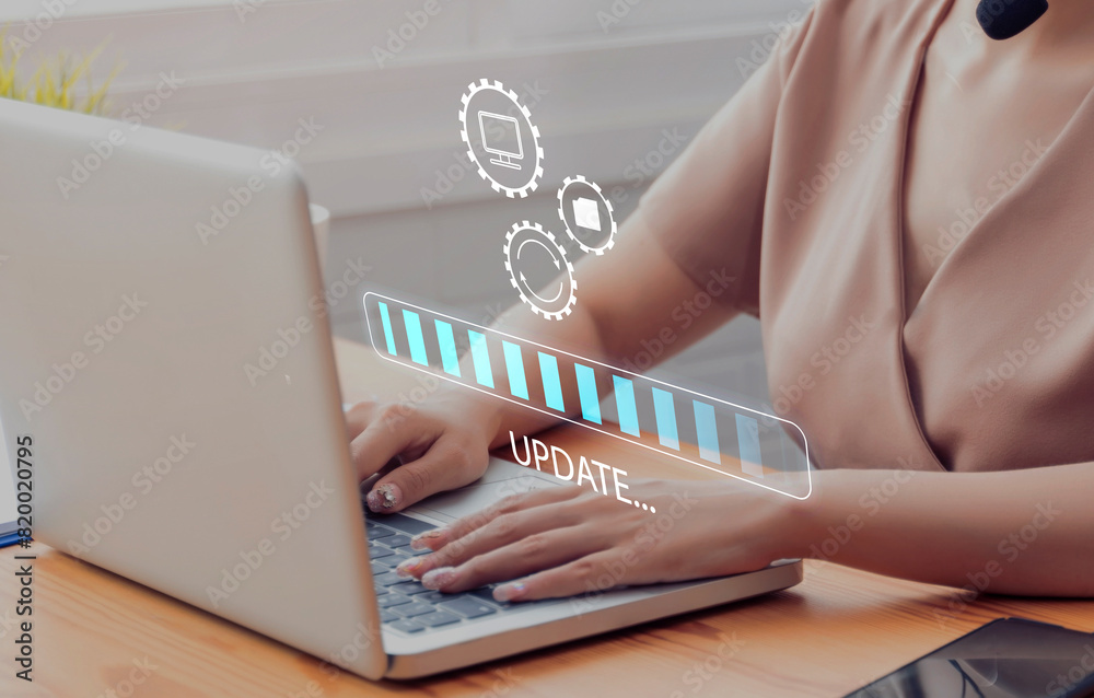 Poster working in office desktop installing update system software for device operating systems to be up to