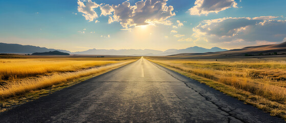 The open road stretches towards distant mountains under a vast sky at sunset, emphasizing remoteness